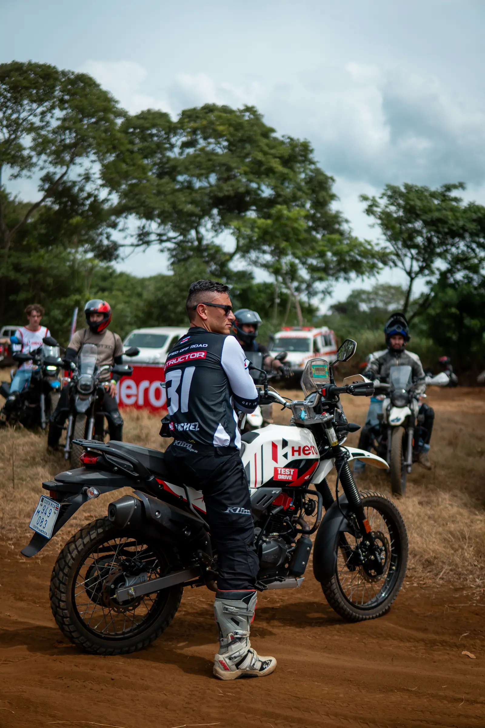 Instructor looking back from a motorcycle before an off-road ride