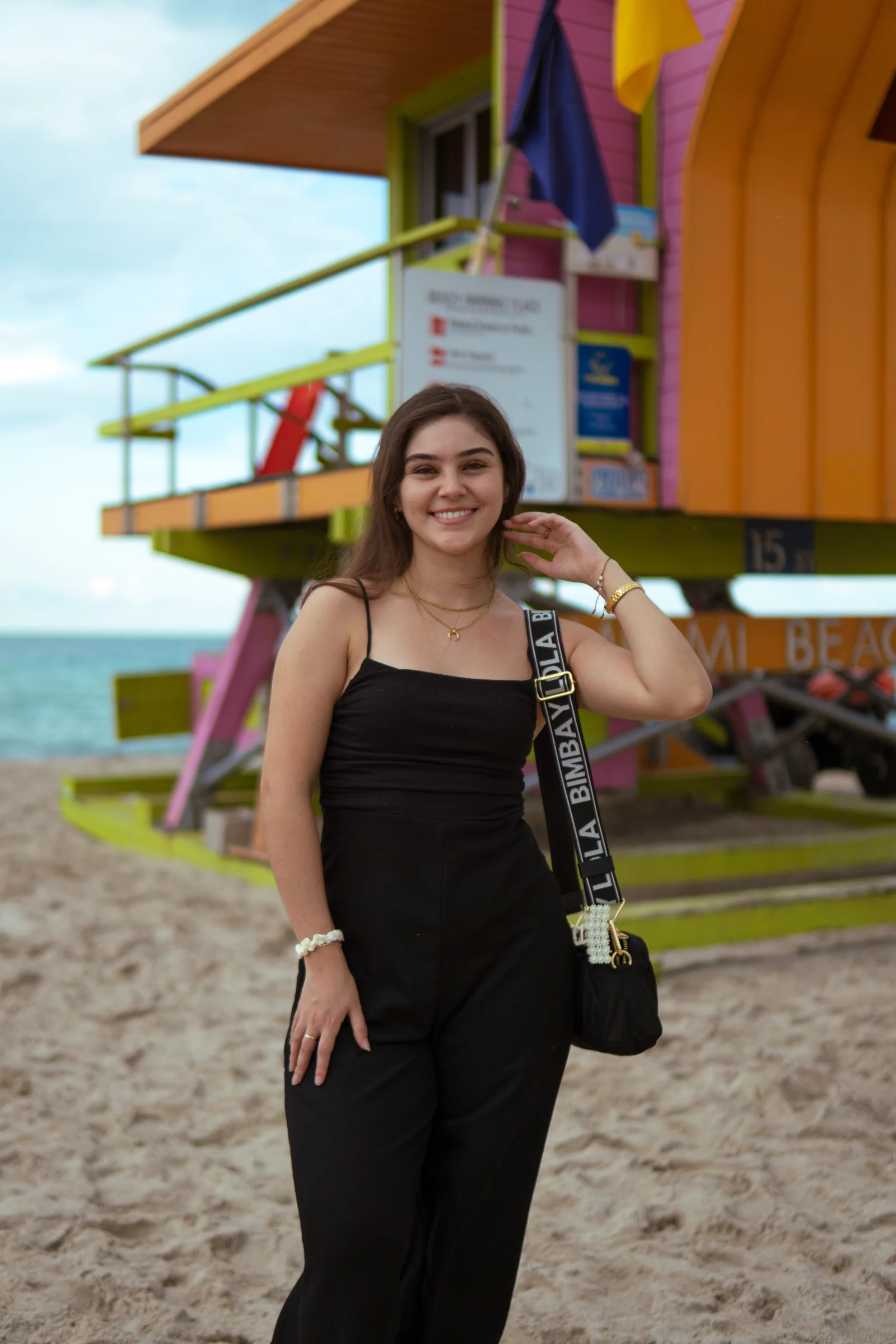 Colorful environmental portrait beside a Miami Beach lifeguard tower